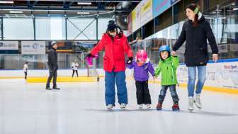 Family on ice skates